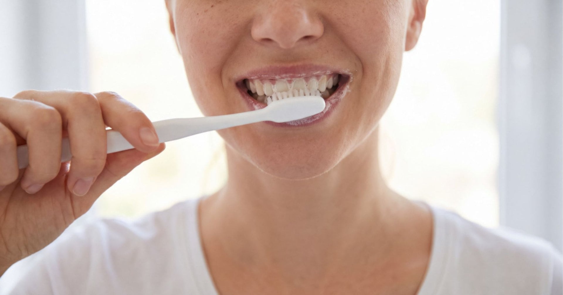 person brushing their teeth relevant to bleeding gums when brushing in Wodonga
